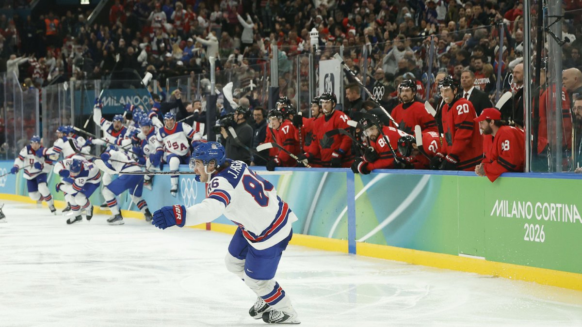 Jack Hughes #86 of Team United States celebrates after scoring the golden goal in overtime against Team Canada during the Milano Cortina 2026 Olympic Winter Games at Milano Santagiulia Ice Hockey Arena.
