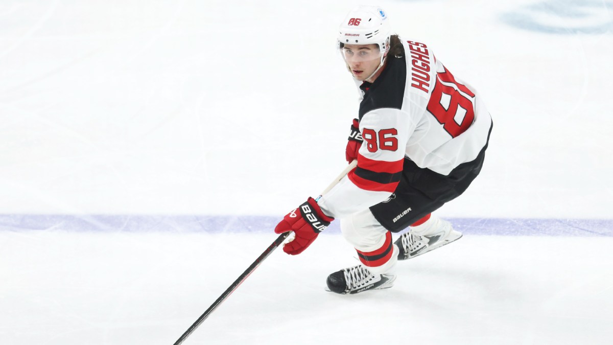 New Jersey Devils center Jack Hughes (86) skates up ice with the puck against the Pittsburgh Penguins during the second period at PPG Paints Arena.