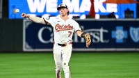 Baltimore Orioles second baseman Jackson Holliday (7) throws to first base during the eighth inning against the Houston Astros at Oriole Park at Camden Yards.