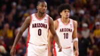 Arizona Wildcats guard Jaden Bradley (0) and forward Koa Peat (10) against the Arizona State Sun Devils at Desert Financial Arena.