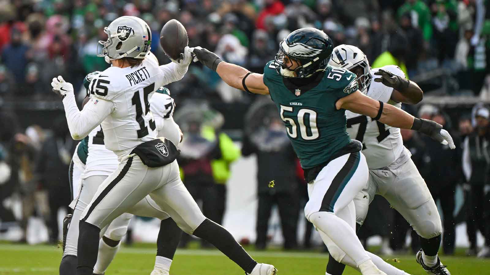 Las Vegas Raiders quarterback Kenny Pickett (15) throws the ball as Philadelphia Eagles linebacker Jaelan Phillips (50) attempts to block during the second quarter at Lincoln Financial Field.