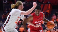 Wisconsin Badgers guard John Blackwell (25) drives the ball past Illinois Fighting Illini forward Jake Davis (15) during the second half at State Farm Center.