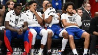 Detroit Pistons players, from left, center Jalen Duren, forward Tobias Harris, guard Jaden Ivey and guard Cade Cunningham react to their 30-point loss to the New York Knicks late in the fourth quarter at Little Caesars Arena.