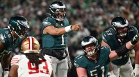 Philadelphia Eagles quarterback Jalen Hurts (1) calls a play at the line of scrimmage against the San Francisco 49ers during the second quarter in an NFC Wild Card Round game at Lincoln Financial Field.