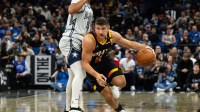 Phoenix Suns guard Grayson Allen (8) dribbles around Orlando Magic guard Jalen Suggs (4) in the third quarter at Kia Center.