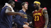Cleveland Cavaliers forward LeBron James (23) gets greeted by guard Mike Miller (18) and center Kendrick Perkins (3) as he goes to the bench during the second quarter against the Detroit Pistons at The Palace of Auburn Hills