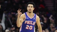 Philadelphia 76ers guard Jared McCain (20) reacts to his three pointer against the Milwaukee Bucks during the first quarter at Xfinity Mobile Arena.