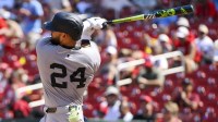 New York Yankees left fielder Jasson Dominguez (24) hits a single against the St. Louis Cardinals during the sixth inning at Busch Stadium.