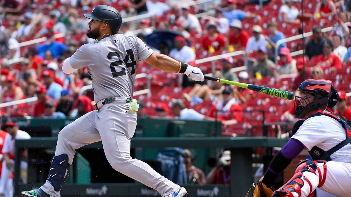 New York Yankees left fielder Jasson Dominguez (24) hits a one run single against the St. Louis Cardinals during the fourth inning at Busch Stadium.