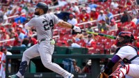 New York Yankees left fielder Jasson Dominguez (24) hits a one run single against the St. Louis Cardinals during the fourth inning at Busch Stadium.
