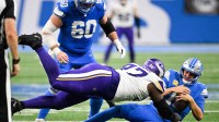 Detroit Lions quarterback Jared Goff (16) is brought down by Minnesota Vikings defensive lineman Javon Hargrave (97) in the third quarter at Ford Field.