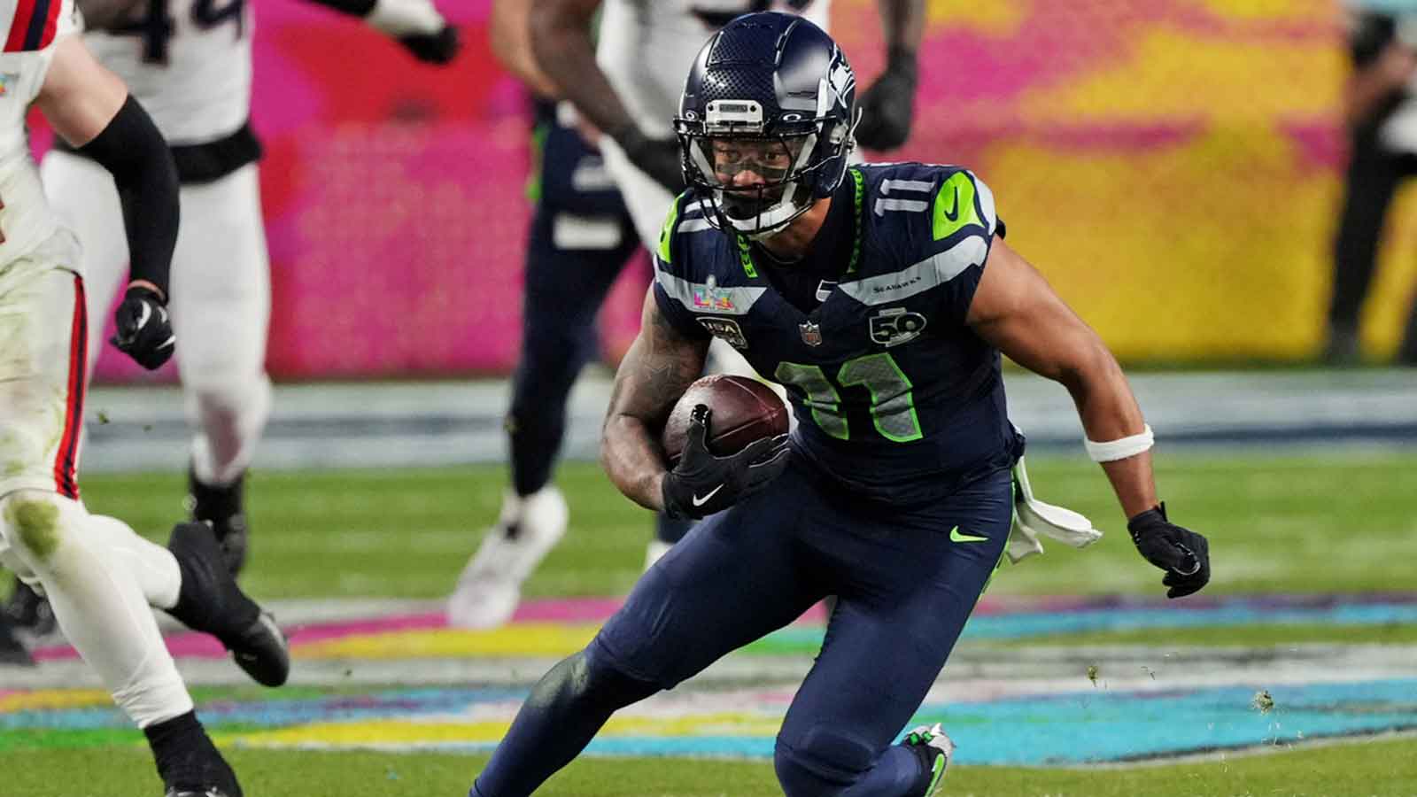 Seattle Seahawks wide receiver Jaxon Smith-Njigba (11) runs the ball during the third quarter against the New England Patriots in Super Bowl LX at Levi's Stadium.