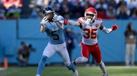 Tennessee Titans wide receiver Elic Ayomanor (5) makes a catch against Kansas City Chiefs cornerback Jaylen Watson (35) during the second half at Nissan Stadium.