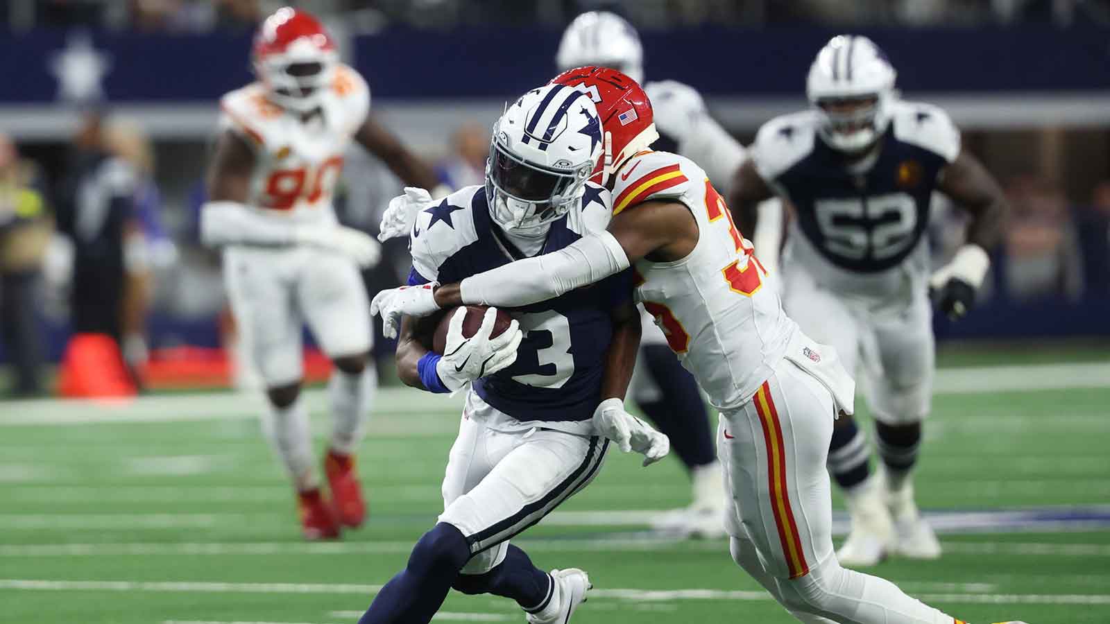 Dallas Cowboys wide receiver George Pickens (3) runs after a catch against Kansas City Chiefs cornerback Jaylen Watson (35) during the fourth quarter at AT&T Stadium.