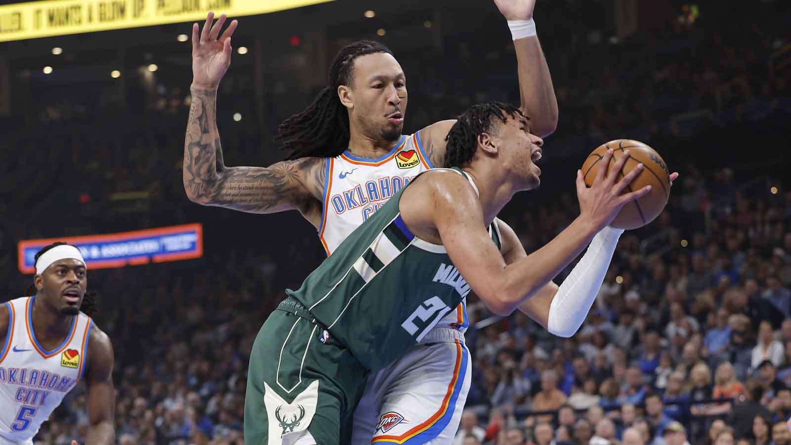 Milwaukee Bucks forward Ousmane Dieng (21) is defended by Oklahoma City Thunder forward Jaylin Williams (6) on the way to the basket during the first half at Paycom Center.