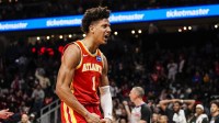 an Atlanta Hawks forward Jalen Johnson (1) reacts after a basket against the Brooklyn Nets during the second half at State Farm Arena.