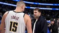 Dallas Mavericks guard Luka Doncic (right) talks with Denver Nuggets center Nikola Jokic (left) after the game at the American Airlines Center.