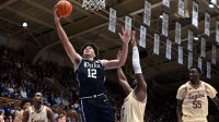 Duke Blue Devils forward Cameron Boozer (12) shoots in front of Boston College Eagles forward Jayden Hastings (22) during the second half at Cameron Indoor Stadium.