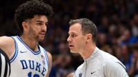 Duke Blue Devils forward Cameron Boozer (12) talks to head coach Jon Scheyer during the first half against the Southern Methodist Mustangs at Cameron Indoor Stadium.