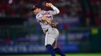 Houston Astros second baseman Jose Altuve (27) throws to first for the out against Los Angeles Angels right fielder Jo Adell (7) during the sixth inning at Angel Stadium.