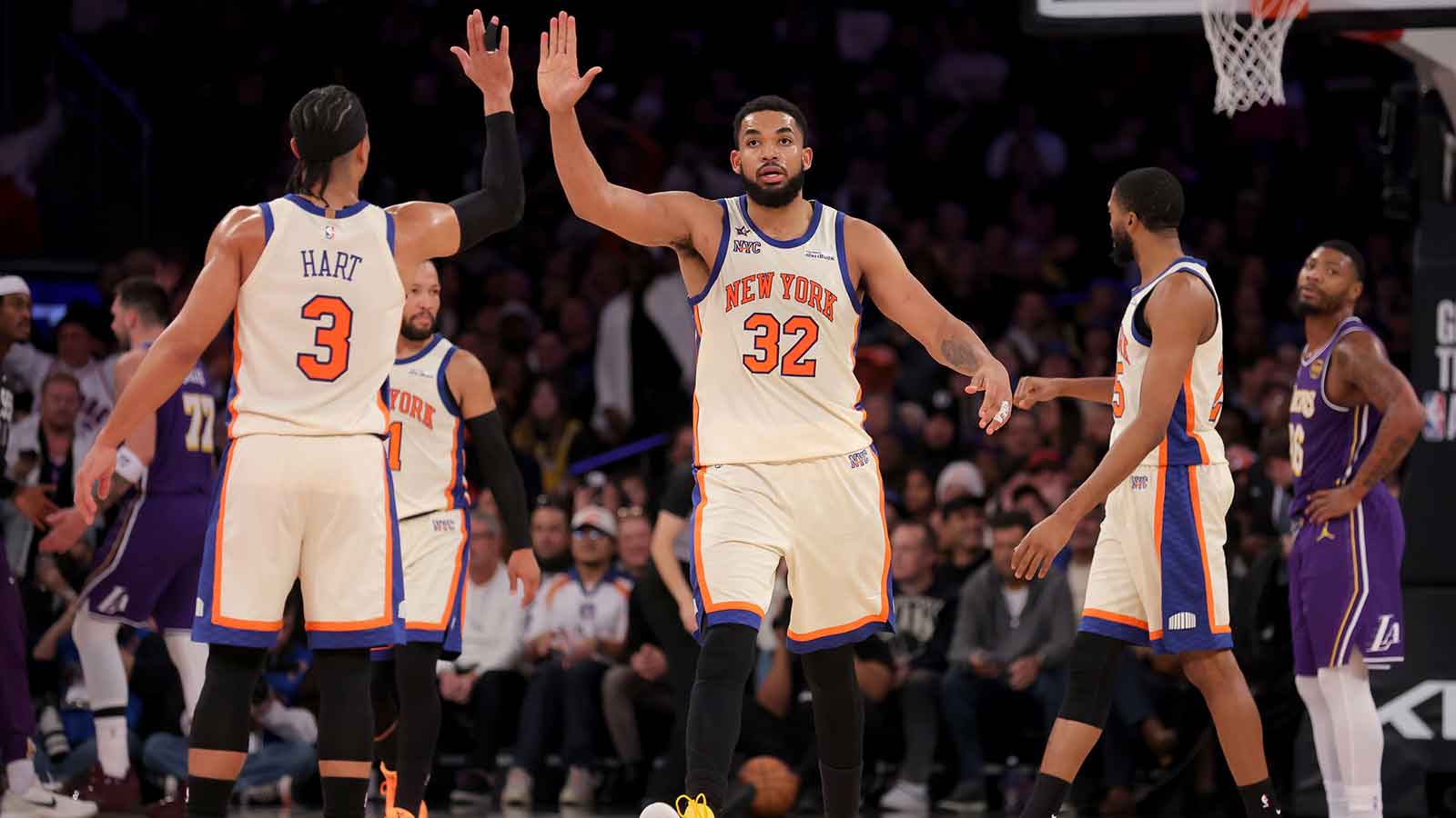 New York Knicks center Karl-Anthony Towns (32) high fives guard Josh Hart (3) during the third quarter against the Los Angeles Lakers at Madison Square Garden.