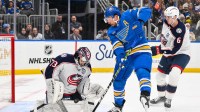 Columbus Blue Jackets goaltender Jet Greaves (73) and defenseman Egor Zamula (6) defend the net against St. Louis Blues defenseman Justin Faulk (72) during the second period at Enterprise Center.