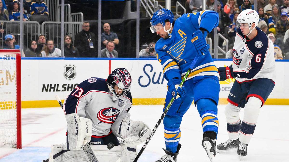 Columbus Blue Jackets goaltender Jet Greaves (73) and defenseman Egor Zamula (6) defend the net against St. Louis Blues defenseman Justin Faulk (72) during the second period at Enterprise Center.