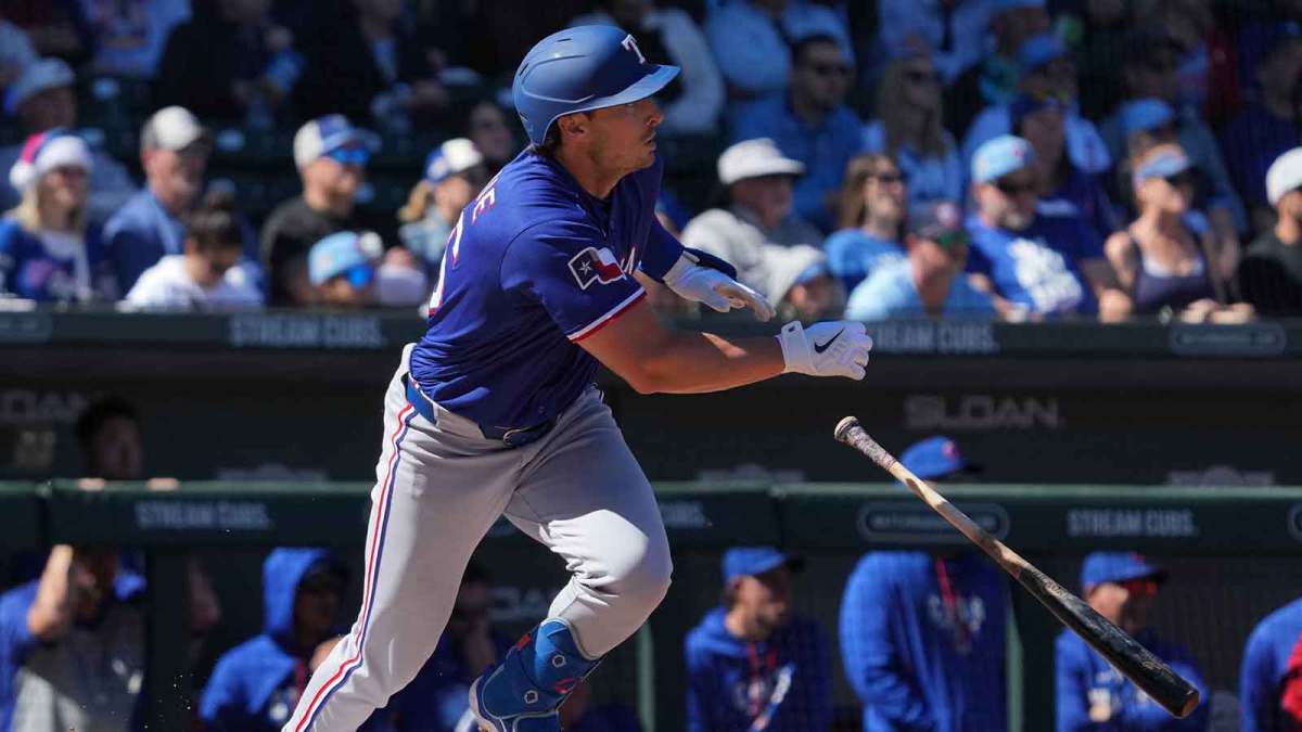 Texas Rangers first baseman Justin Foscue (56) hits against the Chicago Cubs in the first inning at Sloan Park.