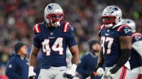 New England Patriots linebacker K'lavon Chaisson (44) celebrates a sack during the second quarter against the Los Angeles Chargers in an AFC Wild Card Round game at Gillette Stadium.