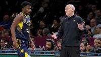 Indiana Pacers head coach Rick Carlisle talks to guard Kam Jones (7) during the first quarter against the Brooklyn Nets at Barclays Center.