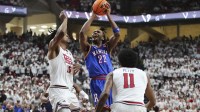 Kansas Jayhawks guard Darryn Peterson (22) goes to the basket against Texas Tech Red Raiders forward JT Toppin (15) in the first half at United Supermarkets Arena.