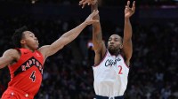 Los Angeles Clippers forward Kawhi Leonard (2) shoots the ball as Toronto Raptors forward Scottie Barnes (4) defends in the second half at Scotiabank Arena.