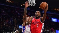 Los Angeles Clippers forward Kawhi Leonard (2) moves to the basket ahead of Philadelphia 76ers guard Kelly Oubre Jr. (9) during the first half at Intuit Dome.