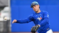 Toronto Blue Jays infielder Kazuma Okamoto (7) throws to home plate during spring training at Bobby Mattick Training Center at Englebert Complex.