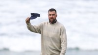 Kansas City Chiefs tight end Travis Kelce acknowledges the crowd on the 10th hole during the second round of the AT&T Pebble Beach Pro-Am golf tournament at Pebble Beach Golf Links.
