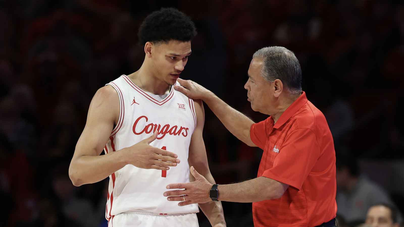 Houston Cougars head coach Kelvin Sampson talks to guard Isiah Harwell (1) in the second half against the UCF Knights at Fertitta Center.