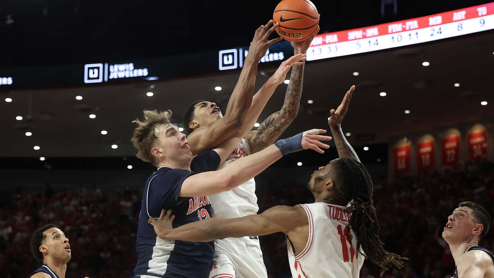 Houston Cougars center Chris Cenac Jr. (5) drives to the net against Arizona Wildcats center Motiejus Krivas (13) in the second half at Fertitta Center.