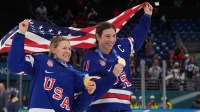 Kendall Coyne (26) of the United States and Hilary Knight (21) of the United States celebrate after winning the gold medal in women's ice hockey after defeating Canada during the Milano Cortina 2026 Olympic Winter Games at Milano Santagiulia Ice Hockey Arena.