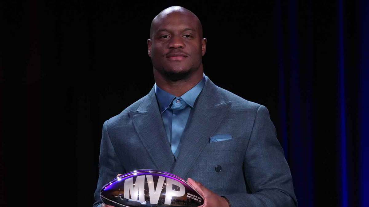 Seattle Seahawks running back Kenneth Walker III poses with the MVP trophy during the Super Bowl LX winning head coach and most valuable player press conference at Moscone Center.