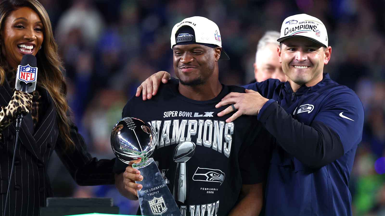 Seattle Seahawks head coach Mike MacDonald and running back Kenneth Walker III (9) celebrate with the Vince Lombardi trophy after defeating the New England Patriots in Super Bowl LX at Levi's Stadium.