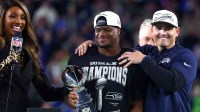 Seattle Seahawks head coach Mike MacDonald and running back Kenneth Walker III (9) celebrate with the Vince Lombardi trophy after defeating the New England Patriots in Super Bowl LX at Levi's Stadium.