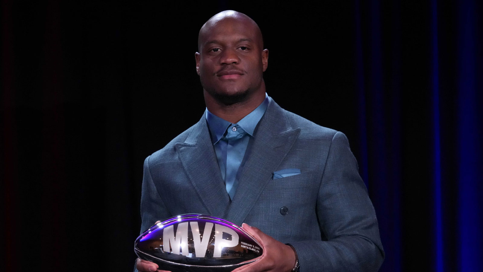 Seattle Seahawks running back Kenneth Walker III poses with the MVP trophy during the Super Bowl LX winning head coach and most valuable player press conference at Moscone Center.