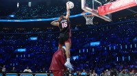 Miami Heat forward Keshad Johnson (16) dunks over rapper E-40 in the slam dunk contest during the 2026 NBA All Star Saturday Night at Intuit Dome.