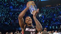Miami Heat forward Keshad Johnson (16) celebrates with the trophy after winning the slam dunk competition during the 2026 NBA All Star Saturday Night at Intuit Dome. Mandatory Credit: Jayne Kamin-Oncea-Imagn Images