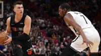 Miami Heat guard Tyler Herro (14) controls the ball around Brooklyn Nets forward Kevin Durant (7) during the first half at FTX Arena.