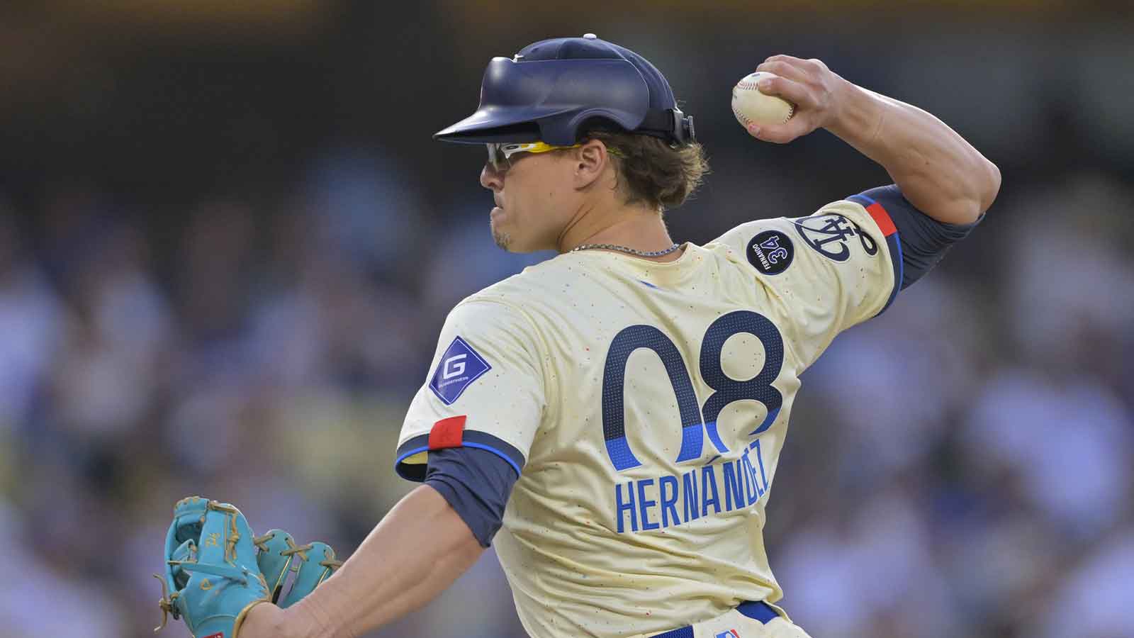 Los Angeles Dodgers first baseman Kiki Hernandez (8) pitches in the ninth inning against the New York Yankees at Dodger Stadium.