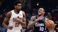 Kings forward De'andre Hunter defends DeMar DeRozan