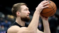 Kings forward Domantas Sabonis (11) takes a shot before a game against the Washington Wizards at Capital One Arena with the Kings and Grizzlies injury report in the background Is Domantas Sabonis playing tonight vs. the Grizzlies