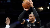 Sacramento Kings guard Russell Westbrook (18) takes a shot before a game against the Washington Wizards at Capital One Arena.
