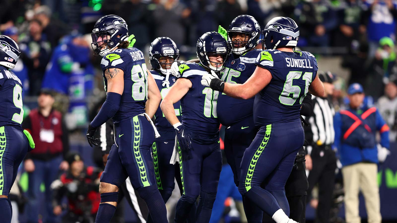 Seattle Seahawks wide receiver Cooper Kupp (10) celebrates with teammates after scoring a touchdown against the Los Angeles Rams during the second half in the 2026 NFC Championship Game at Lumen Field.